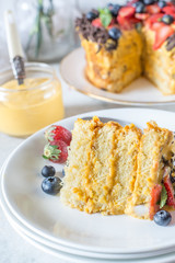 mango fruit cream cake with chocolate berry strawberry and mint