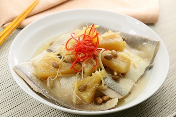 Sauce of milkfish with braised pineapple and sliced chili on whi