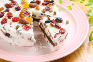 Red bean sponge cake with almond and berry on white plate