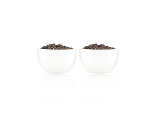 Coffee beans in white glass of coffee isolated on white backgrou