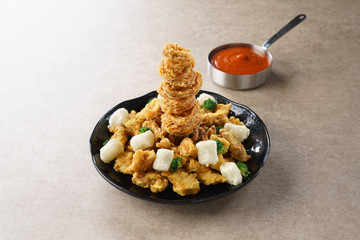 Squid Chicken service queue through with chili sauce