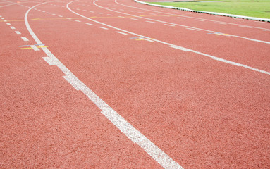 Red running track in stadium.