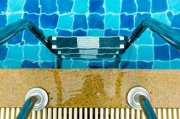 Swimming pool with stair at the Clubhouse close up.