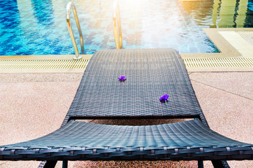 Poolside loungers at an exotic asian hotel. And the evening sun.
