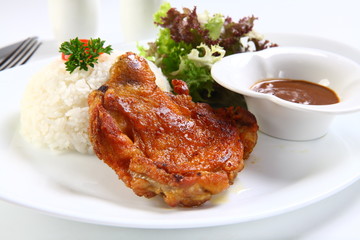 Vietnamese ribs broken rice or com tam suon on white plate