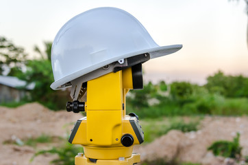 Closeup theodolite outdoors at construction road  Selective focus.