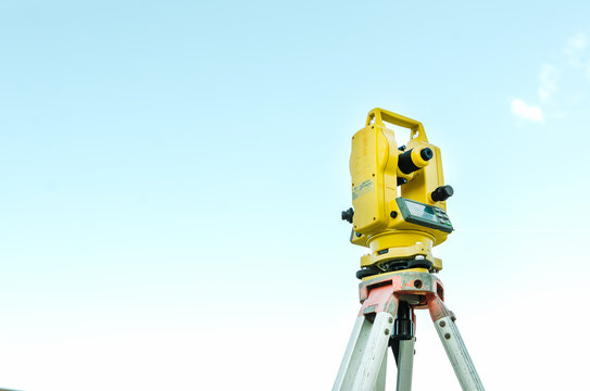 Closeup theodolite outdoors at construction road  Selective focus.