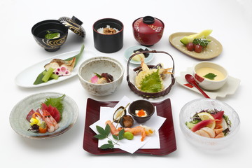 Tray meal of Japanese style with rice, sushi and soy sauces