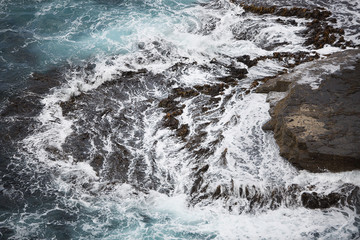 Waves crashing on Rocks