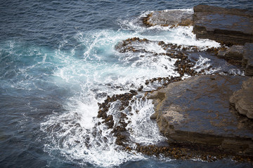 Waves crashing on Rocks