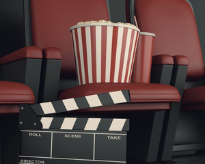 Naklejka premium 3d Cinema clapper board and popcorn on theater seat.