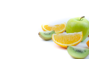 Fototapeta na wymiar Apple and sliced orange and kiwi on white background.