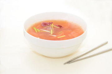 Tomato mushroom soup on white bowl in white background