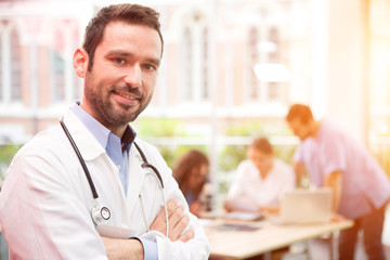Portrait of a young attractive doctor at the hospital