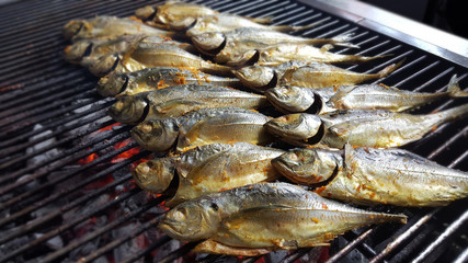 The outdoor barbecue corner serves freshly grilled fish on hot c
