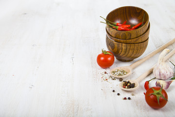Vegetables and spices in wooden bowls