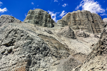 colorful rocks on the background of blue sky with clouds