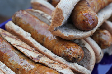 Fried pork sausages with bread in local market