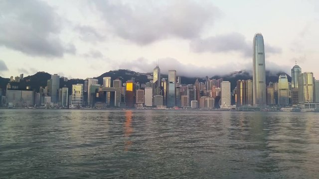 Skyline of Hong Kong in the morning. Beautiful skyscrapers with colorful sunrise sky