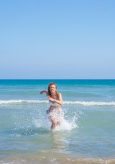 Fototapeta premium Woman in bikini enjoying the sea
