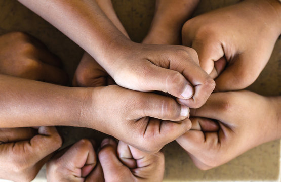 team showing unity, people putting their hands together ,concept successful people or team work
