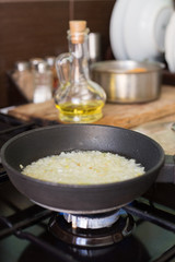 Fried onions in a frying pan