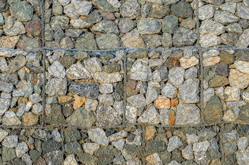 Stone walls prevent landslides in country road.