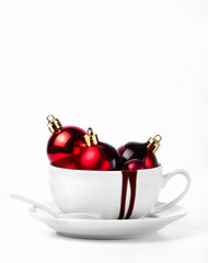 Christmas sweet chocolate concept - christmas decorations in a cup with melted chocolate, closeup