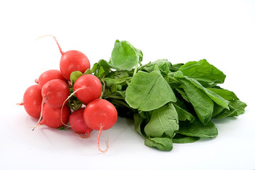 Red fresh radish with green leaves on white background