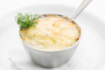 Delicate mushrooms in cream sauce on white background