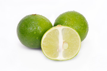 Lemon or lime fruit with half cross section and partial section