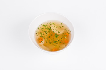 Chicken soup with home-made pasta in white bowl background