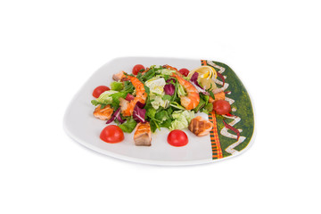 Mexican style of salads with shrimps, salmon, lemon and lettuce