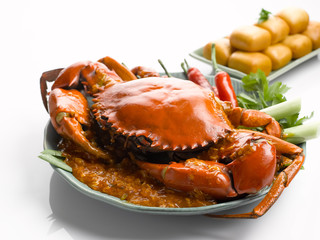 Special fried crab with chili sauce and fried dumplings on white