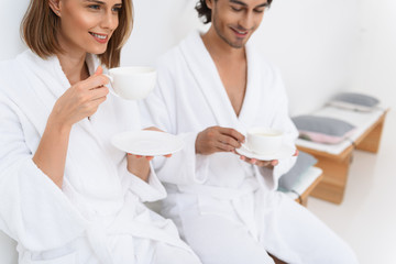 Mature couple relaxing together at day spa