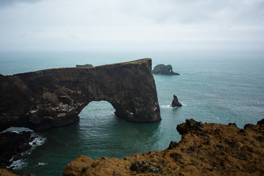 Rock arch at Dyrholaey coast, South Iceland.