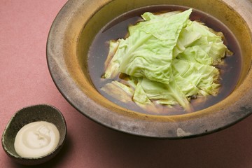 Sweet and fresh spring cabbage as flower petals, pork to wine po