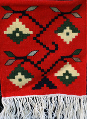 Hand-woven carpet with ethnic and folk pattern