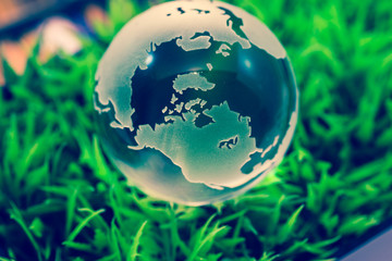 Obraz na płótnie Canvas Crystal globe on grass