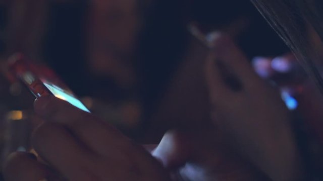 Young bride using phone at the table. 3840x2160
