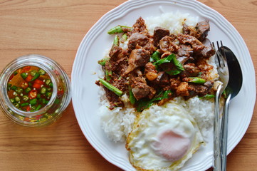 spicy stir fried chicken entrails curry and egg with fish chili sauce cup