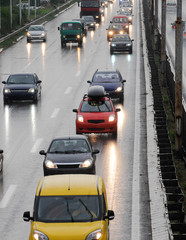 Cars rush on highway during rainy day