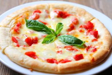 Classic Pizza Margherita with herbs, cheese and bacon on white p