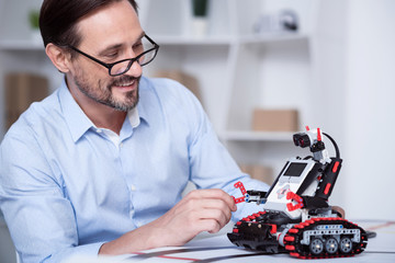 Professor laughing while creating a new machine