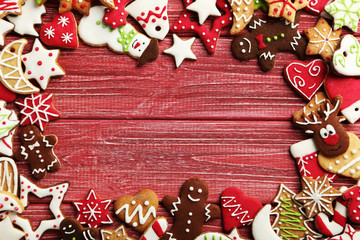 Christmas cookies on a red wooden table