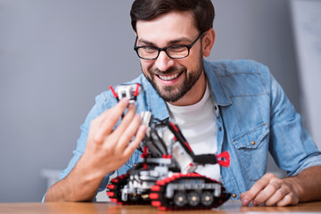 Positive engineer using robot