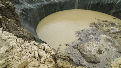 YAMAL PENINSULA, RUSSIA - JUNE 18, 2015: Expedition to the giant funnel of unknown origin. Crater view.