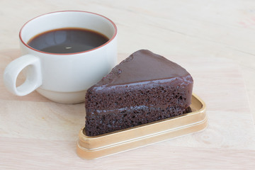 chocolate cake and coffee on the table.
