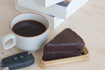 chocolate cake and coffee on the table.