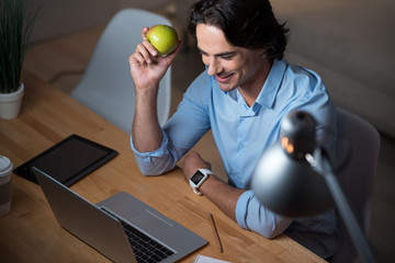 Handsome young man using laptop.